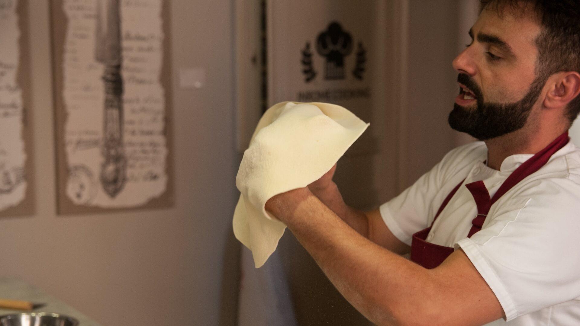 Chef Max making Pizza on one of Walks Inside Rome's Cooking Classes
