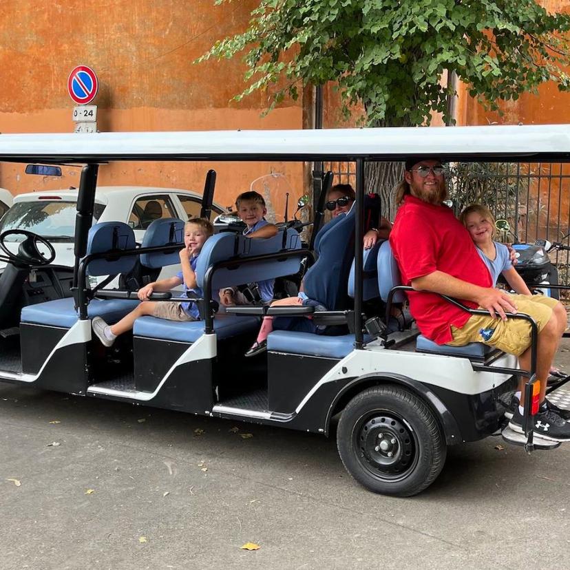 family-enjoying-golf-cart-tour Family enjoying golf cart tour