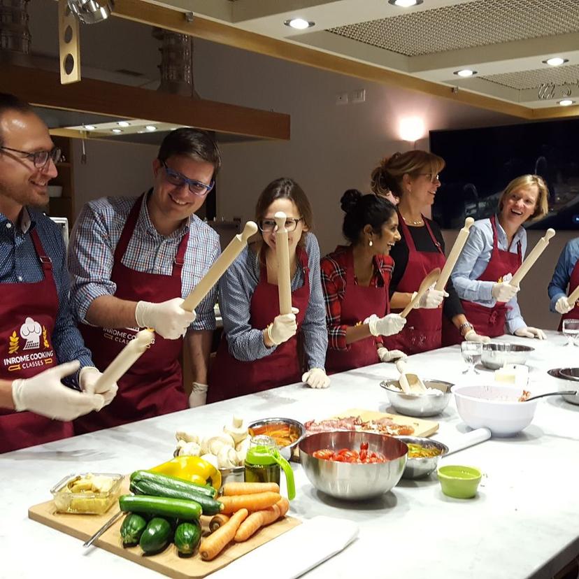 Pizza Making class Tourist smiling and making pizza class in Rome, learning how to prepare traditional italian pizza