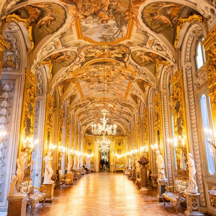 Historic atmosphere inside Doria Pamphilj gallery with statues, golden walls, and Renaissance frescoes Historic atmosphere inside Doria Pamphilj gallerywith statues, golden walls, and Renaissance frescoes
