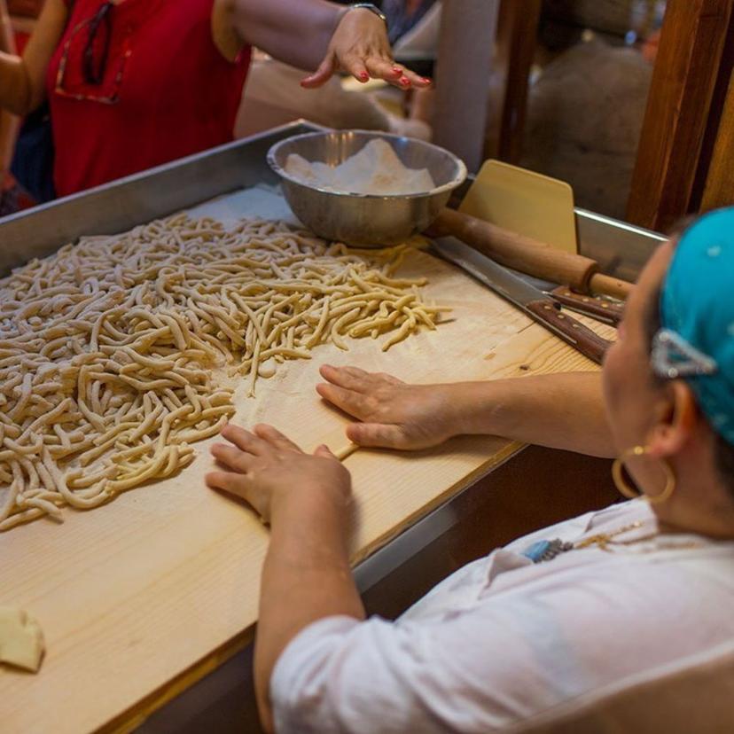 Fresh Pasta Restaurant staff making fresh pasta by hand in front of guests during a Trastevere food tour