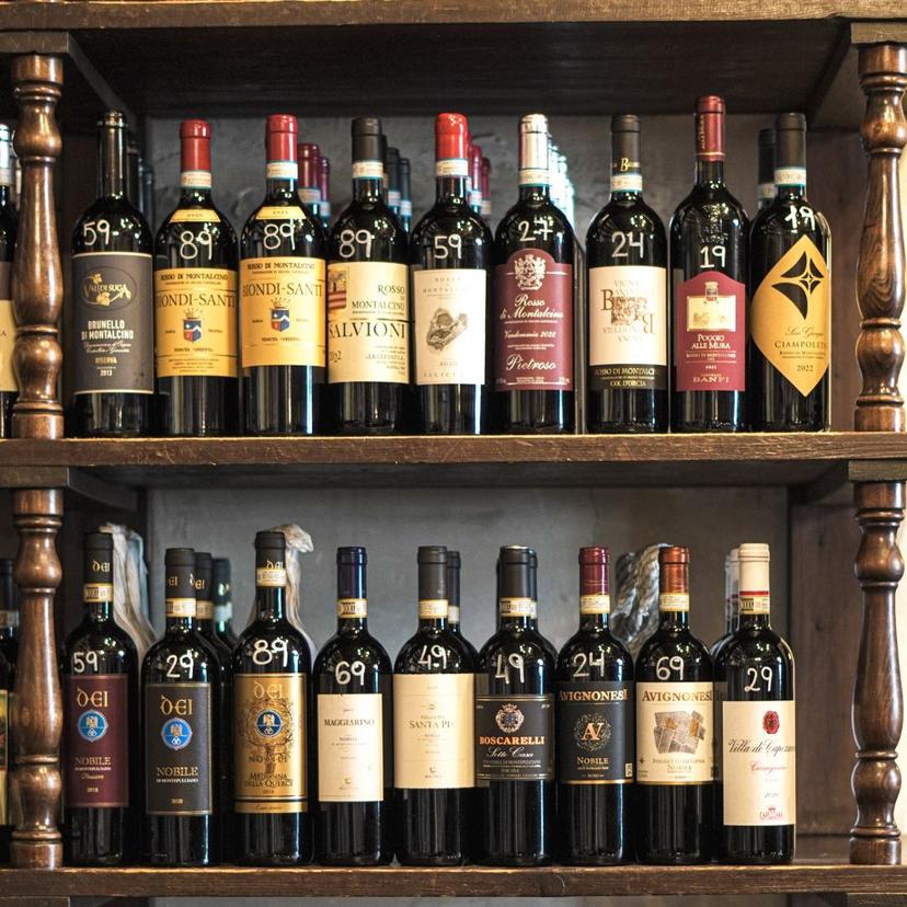 Wall of wine bottles Wall of wine bottles on display inside a traditional wine bar in Rome during a wine tasting tour