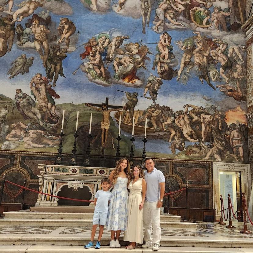 Family Inside Sistine Chapel Posing Family Inside Sistine Chapel Posing On Steps Artwork In Backround