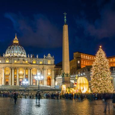 t. Peter’s Square Christmas Tree and Nativity Scene in Rome – December Holidays Christmas tree and Nativity scene illuminated in St. Peter’s Square at night with St. Peter’s Basilica in the background.