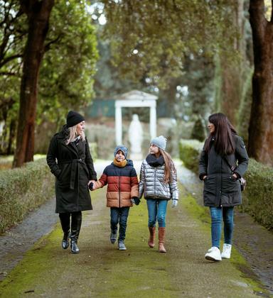 Walking through the Papal Estate gardens Family walking through the Papal Estate gardens in Castel Gandolfo during the Complete Papal Experience tour